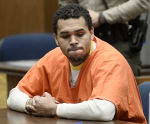 LOS ANGELES-CA-MAY 9: R&B singer Chris Brown (C) appears in court for a probation violation hearing in Los Angeles Court on May 9, 2014 in Los Angeles, California.  Chris Brown was sentenced to an additional year in jail, serving another 131 days after credit for days already served. (Photo by Paul Buck-PoolGetty Images)