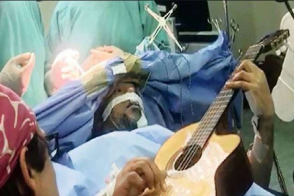 South African jazz artist plays guitar during brain surgery